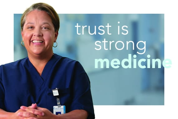 Smiling provider with the words "Trust is strong medicine"