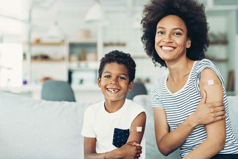 Smiling mother and son who got vaccinated