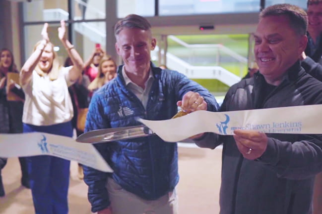 Mark Scheurer, M.D. and Shaw Jenkins cutting the ceremonial opening ribbon to the Shawn Jenkins Children's Hospital and Pearl Tourville Women's Pavilion.