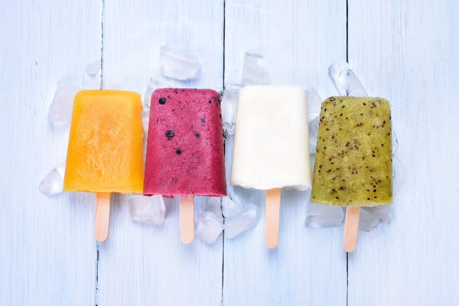 A lineup of four delicious-looking popsicles