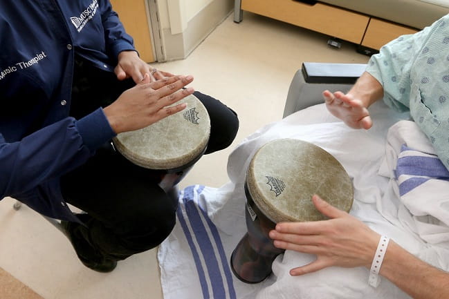 Art therapist and patient playing percussion instruments