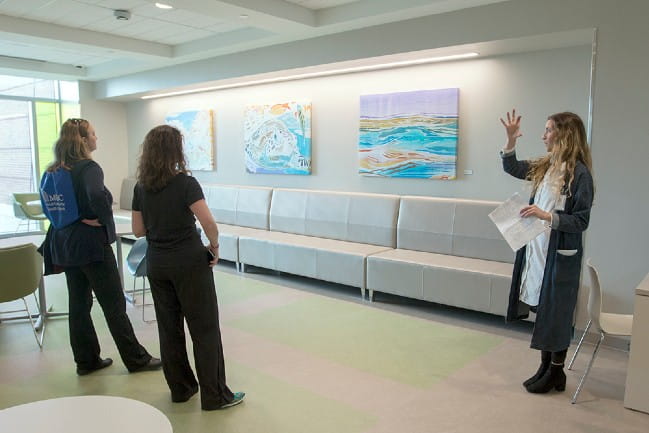 Care giver leading art tour of MUSC's collection