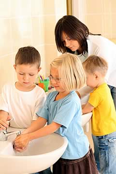 Image of children washing their hands.