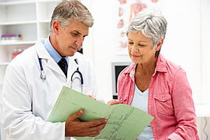 Doctor showing information to a patient