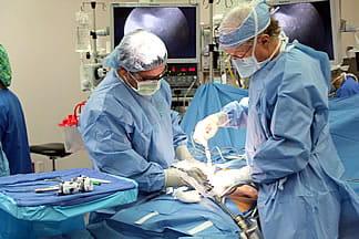 Surgeons performing an islet cell autotransplantation procedure.