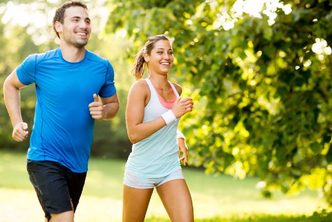 Smiling couple jogging.
