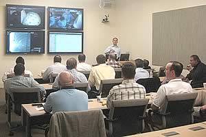 A physician training seminar in the DDC video conference room 