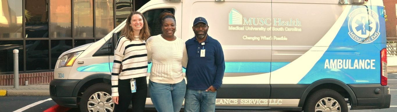 Some of the MUSC Health TTVIP standing in front of an MUSC Health ambulance.