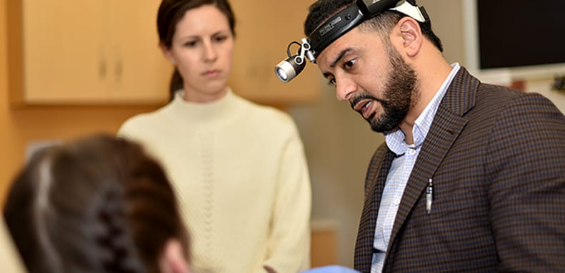 Dr. Mohamed Abdelwahab speaks to a patient about sleep surgery options at the MUSC Health sleep clinic. 