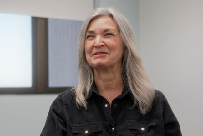 Smiling cochlear implant recipient