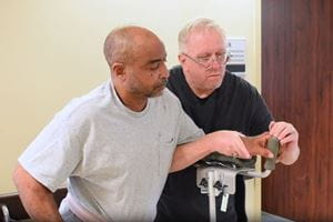 A staff member with a patient at the Florence Rehabilitation Center.
