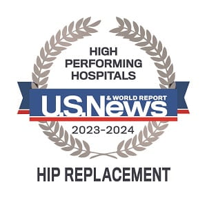Badge that says High Performing Hospitals | US News and World Report | 2023 through 2024 | Hip Replacement