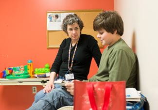 Dr. Jane Charles with child with autism