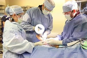 screen capture of talus replacement video from Medical Video Center showing surgeons performing the talus replacement