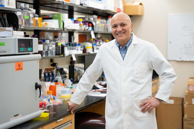 Dr. Besim Ogretman stands in his lab. 