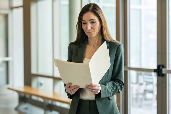 Constance Guille, M.D., examines a patient chart