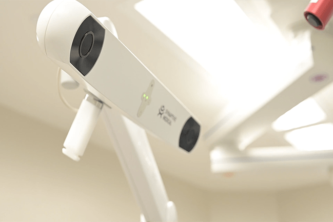 Robotic surgical arm in operating room