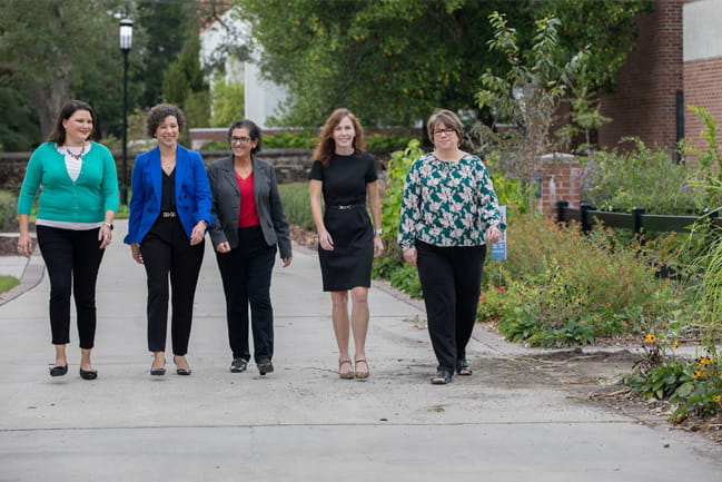 physicians involved in the women in stem programs walk together