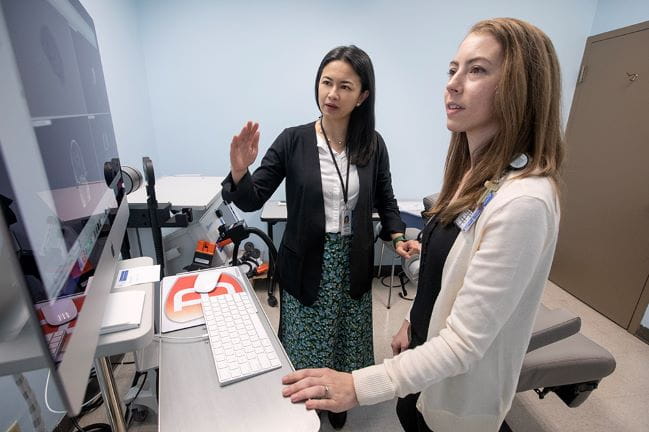 MUSC neuroscientists Andreana Benitez, Ph.D., (in back) and Stephanie Fountain-Zaragoza, Ph.D. (in front) discuss a neuroimaging result.
