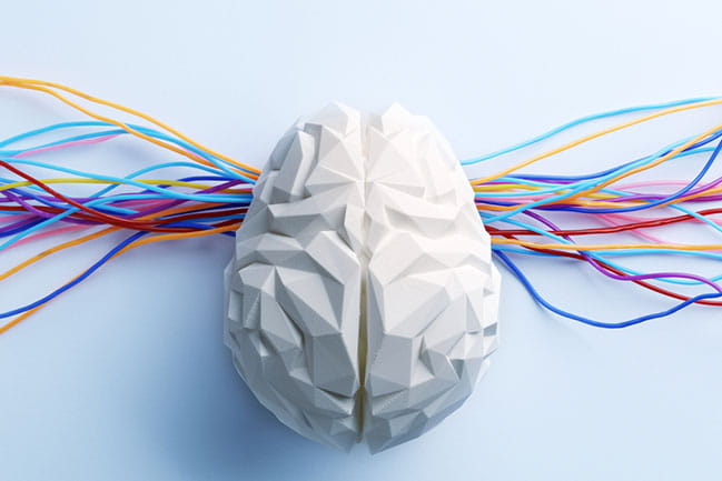 Illustration of brain with colorful wires attached