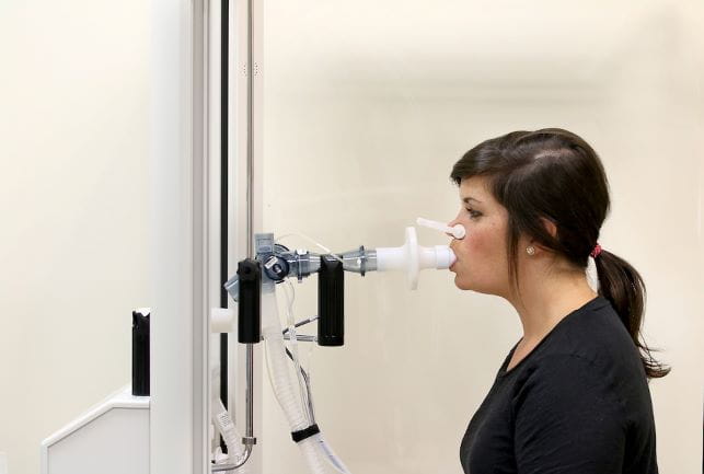 a coordinator demonstrates pulmonary function testing