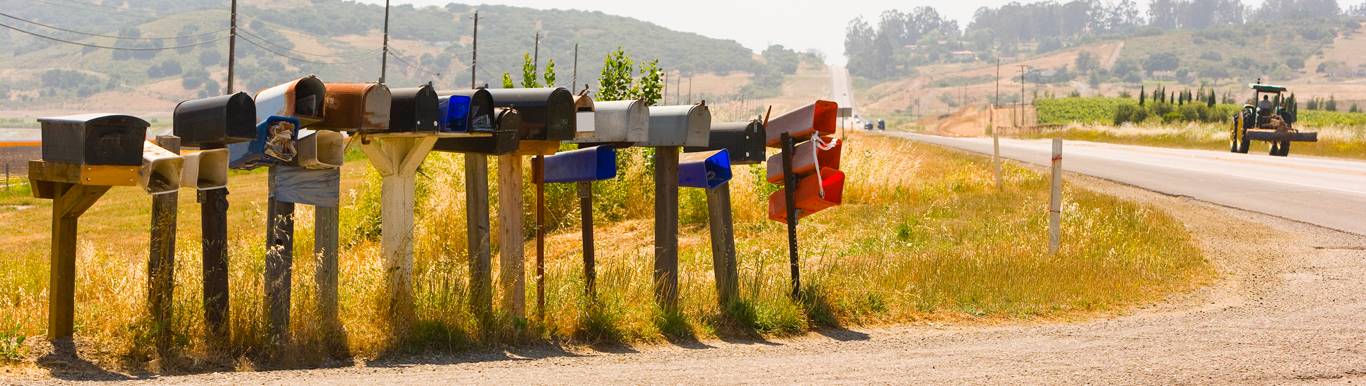 Row of mailboxes along country dirt road