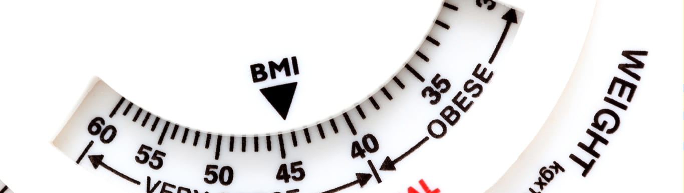 A decorative close up of a weight scale showing body mass index (BMI) and weight