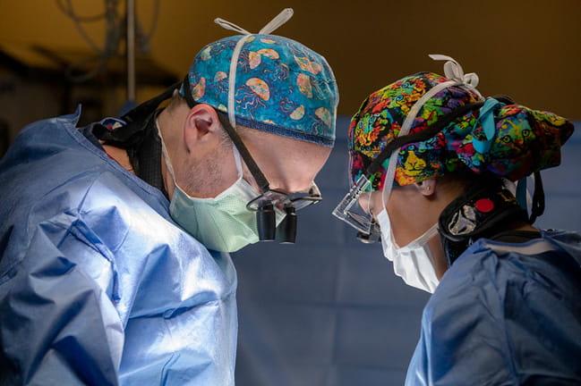 Two surgeons perform procedure using VORTEX device