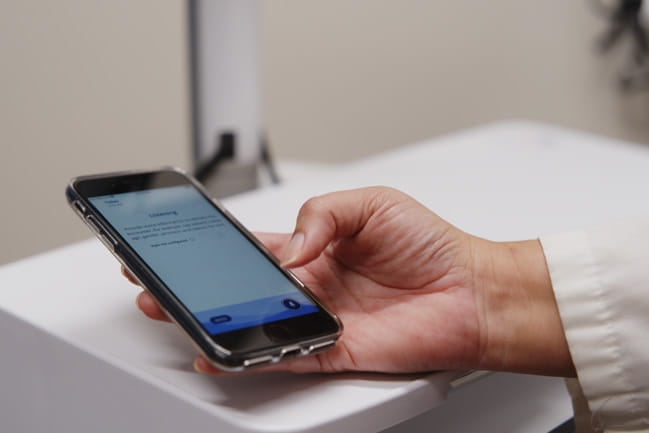 Phone being used in a doctor's appointment to listen