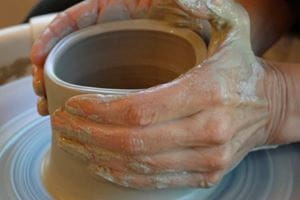 MUSC hand & wrist surgery patient Kim Percival creates pottery with her healed hands.