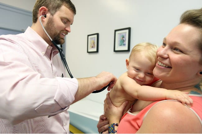 Dr. Edmondson with a patient.