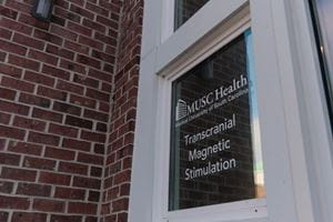 Door that reads MUSC Health Transcranial Magnetic Stimulation