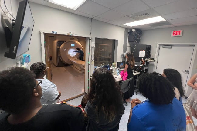 During a TSAP meeting, students were able to take a tour of an MRI Scanner and learn more about it from 3T MRI Program Manager, Scott Henderson.