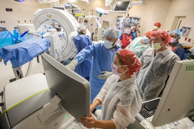Providers in operating room using robotic-assisted technology
