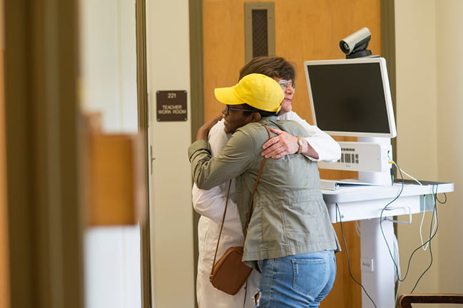 Photo of doctor and student hugging