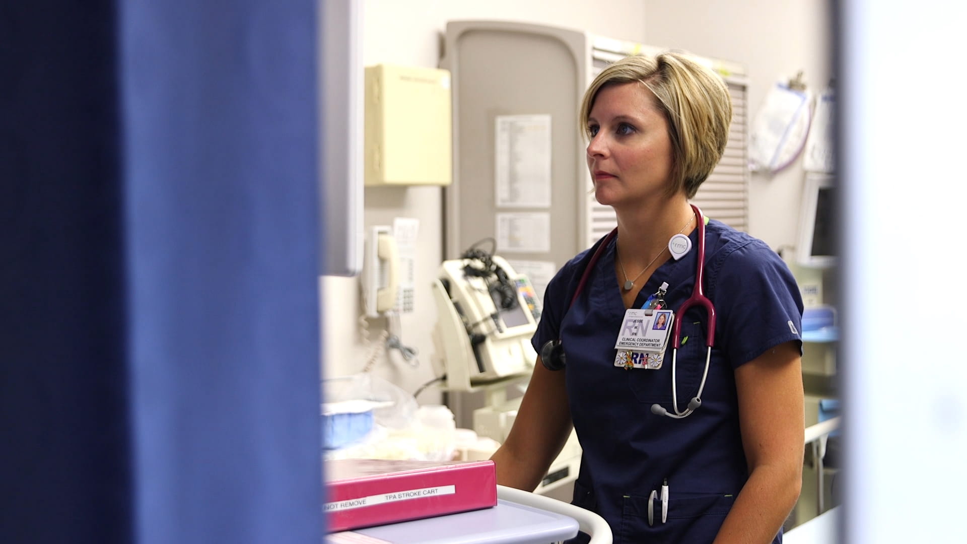provider looking at telemedicine cart screen in hospital