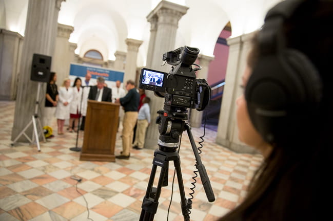 Media specialist filming at an event