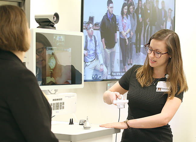 students viewing demonstration during tour