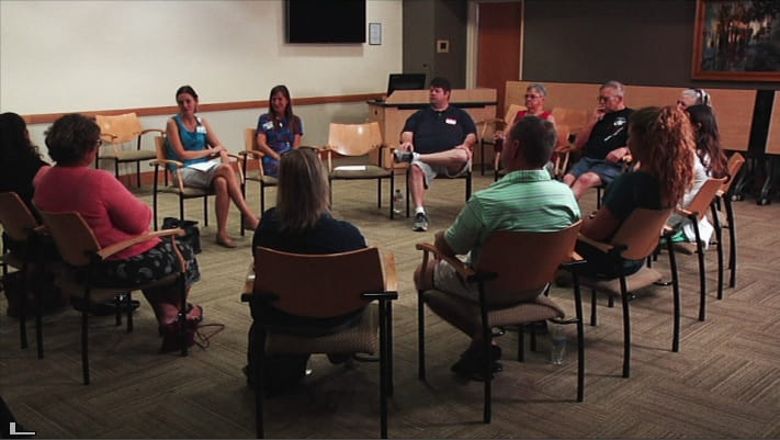 Patients sitting in circle at support group