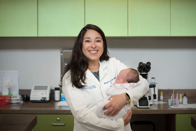 Dr. Helton-Rieter with newborn