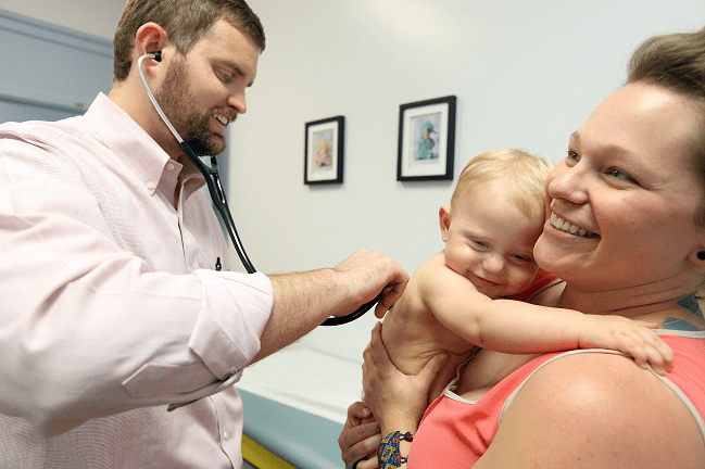 Moncks Corner Pediatrician Dr. Luke Edmonson examines young patient.