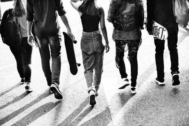 Image of five teenagers walking