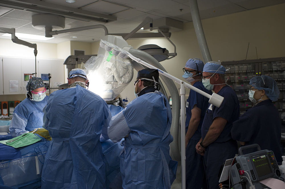 A team of surgeons led by Dr. John Lacy Sturdivant gathers for the implantation of what could be a life-changing device in the heart of a Pawleys Island man. Photo by Brennan Wesley