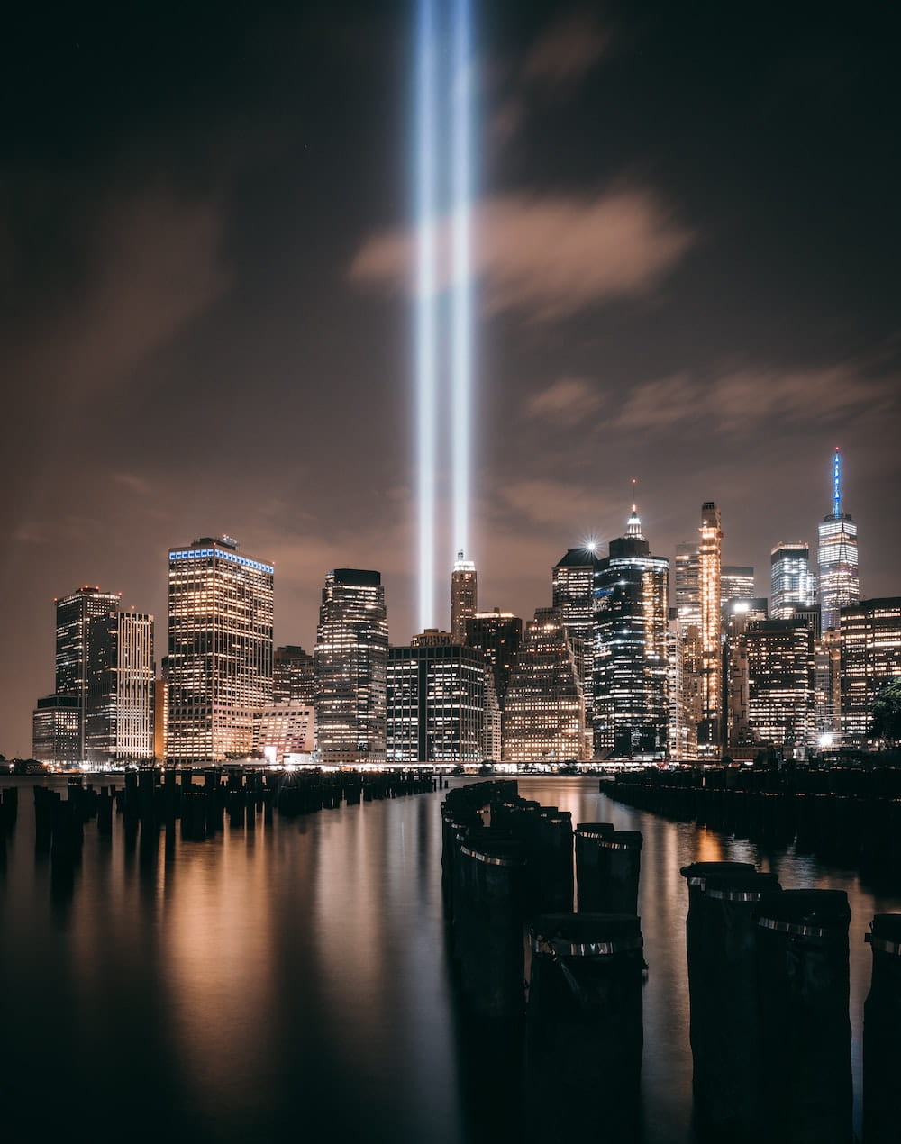 Two beams of light going straight up into the night sky to symbolize the former Twin Towers in NYC