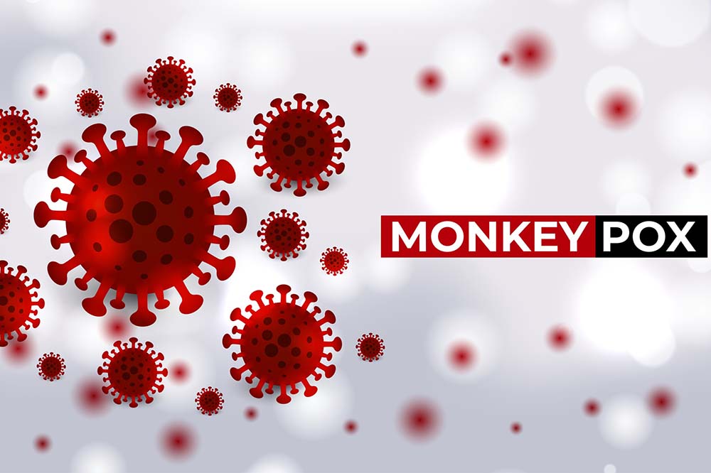 Red virus cells with the word monkeypox.