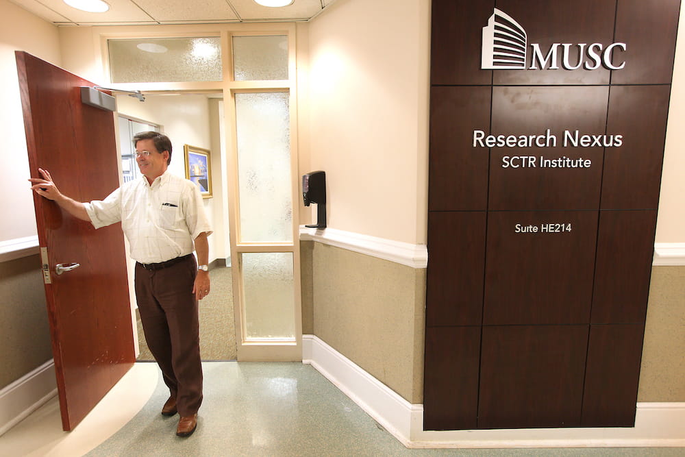 Dr. Patrick Flume standing in front of SCTR's Nexus Research Center, where he conducts cystic fibrosis trials.