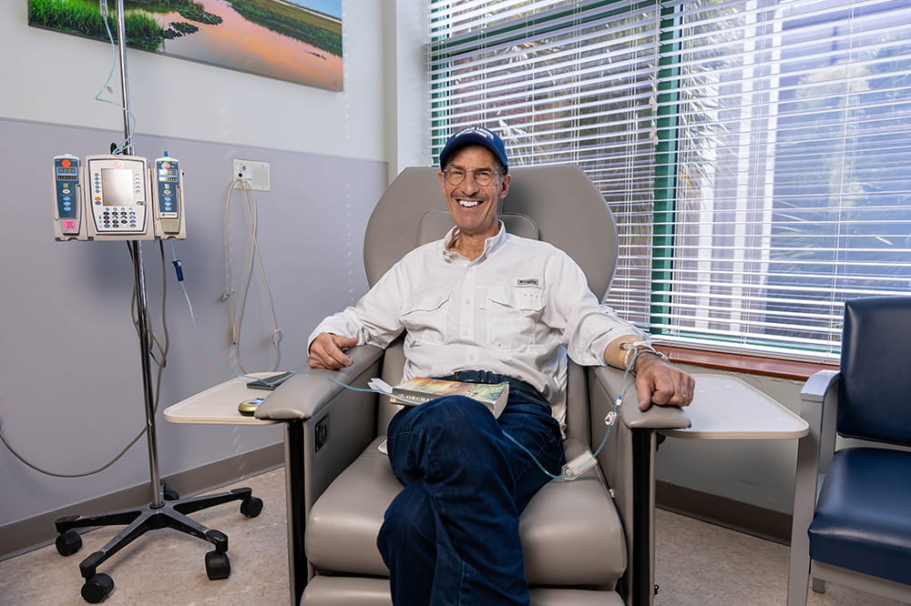 immunotherapy patient Andy Abrams smiles and looks relaxed during his infusion treatment
