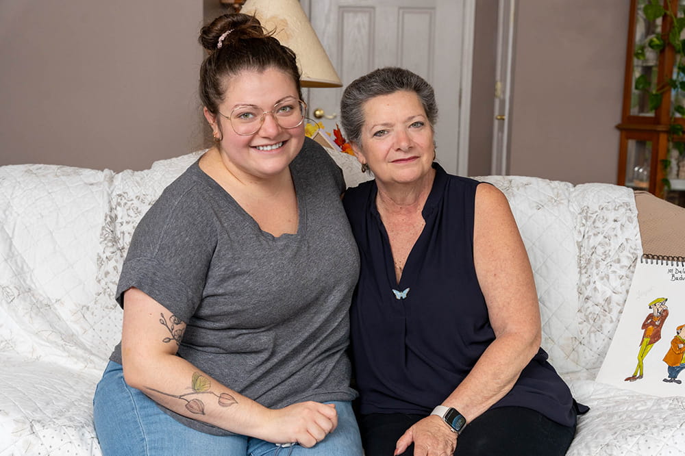 image of two women on sofa