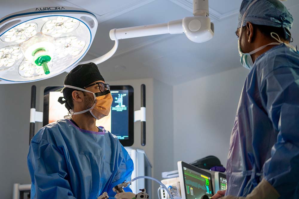 Two men in surgical scrubs.
