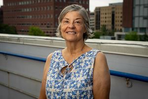 portrait of a woman on rooftop with MUSC buildings behind her